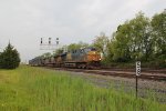 CSX 5494 leading a train under the signal bridge at milepost 58